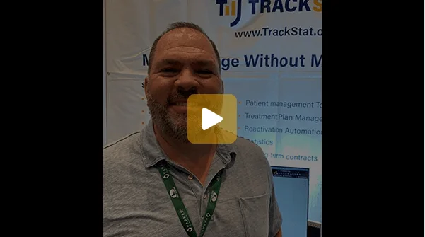 Dr. Mike Cormier at a TrackStat conference booth
